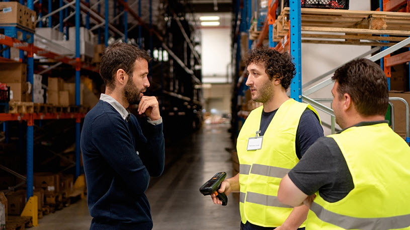 The manager talks to two warehouse workers Navigating U.S. Labor Law: Key Insights for Employers