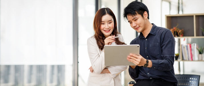 young Asian woman and man in office casual meeting young Asian woman and man in office casual meeting