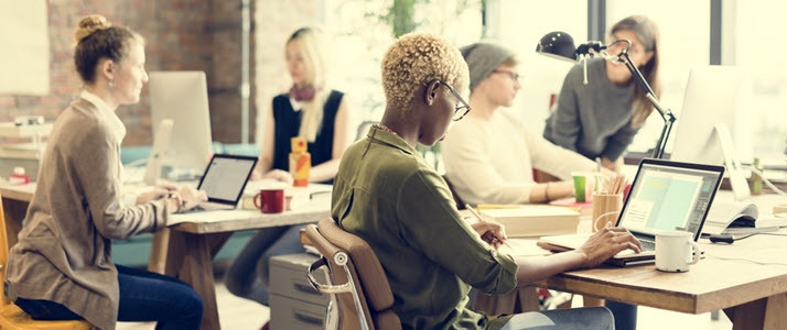 How to make flex time work Office employees work at their desks on a flexible schedule