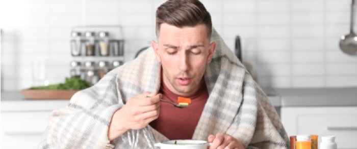 Are Your Employee Absence Policies Encouraging Presenteeism? A sick man spends the day at home.