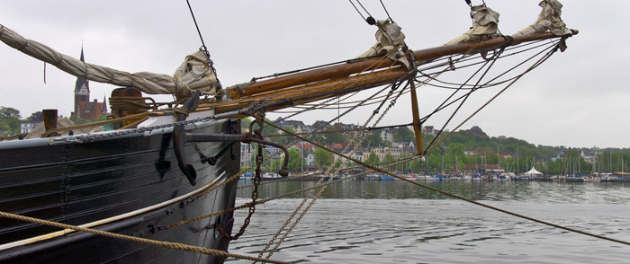 ERISA Plan. A ship sails into a harbor.