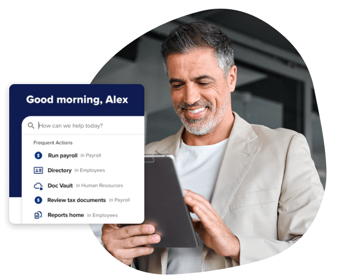 Man looking at his tablet device with ADP payroll dashboard interface overlayed